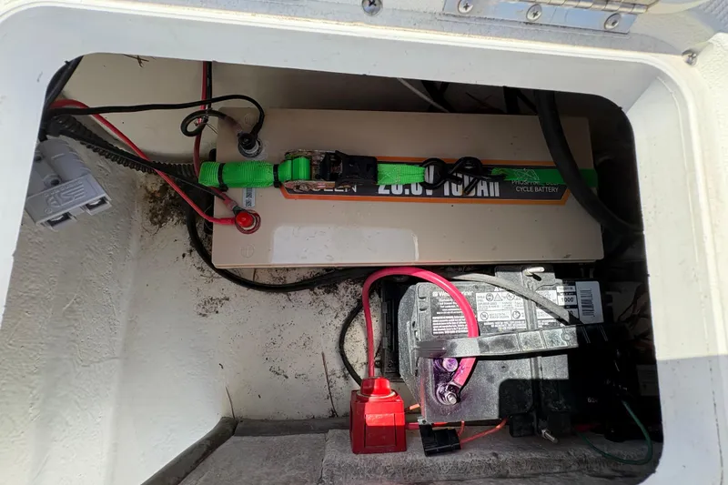 Slide: The Image of Battery compartment of a 2014 Sundance B20CCR boat with wiring and connections. - 9