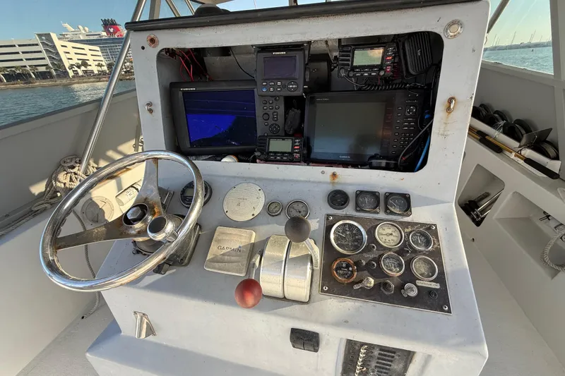 Slide: The Image of Control panel of a 1988 Stuart Angler 32 boat with navigation instruments. - 14