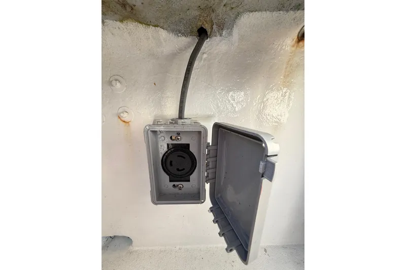 Slide: The Image of Electrical outlet with open cover on 1988 Stuart Angler 32 boat. - 25