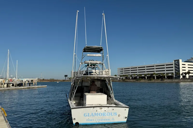 Slide: The Image of 1988 Stuart Angler 32 boat docked at Port Canaveral, clear blue sky. - 5