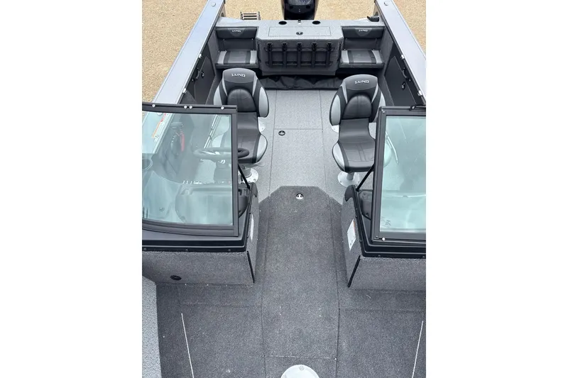 Slide: The Image of 2026 Lund 1875 Fisherman boat interior with seating and windshield view. - 5