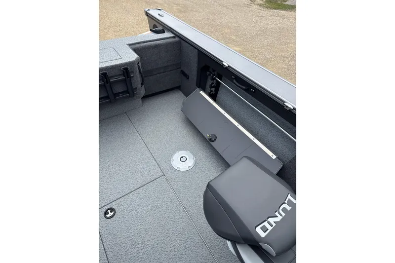 Slide: The Image of 2026 Lund 1875 Fisherman boat interior with seating and storage compartments. - 8