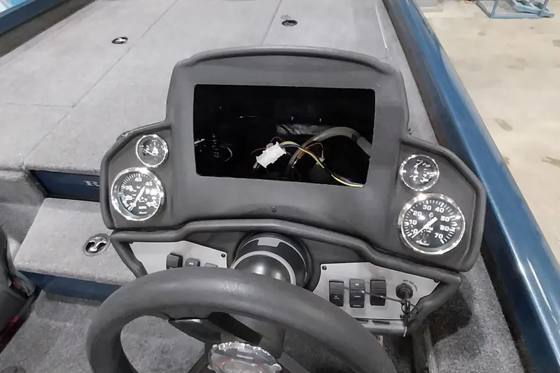 Slide: The Image of 2024 Ranger RT198P boat dashboard with gauges and steering wheel. - 20