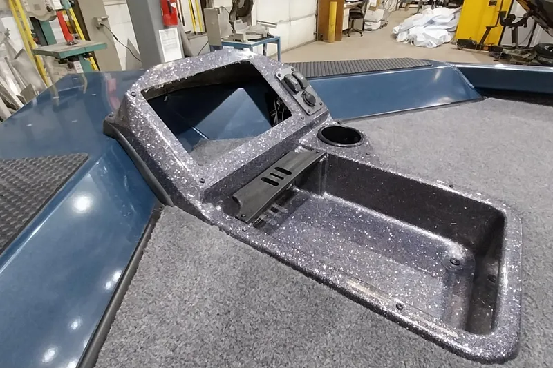 Slide: The Image of 2024 Ranger RT198P boat console with cup holder and storage compartment. - 24