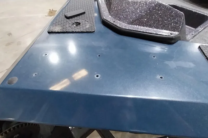 Slide: The Image of 2024 Ranger RT198P boat deck with textured surface and mounting holes. - 26