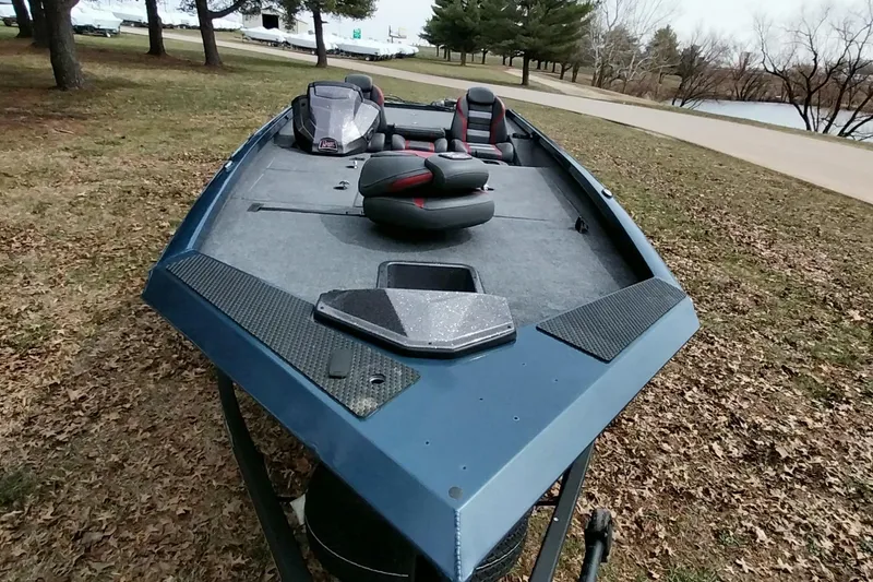 Slide: The Image of 2024 Ranger RT198P fishing boat on grassy area near a lake. - 36