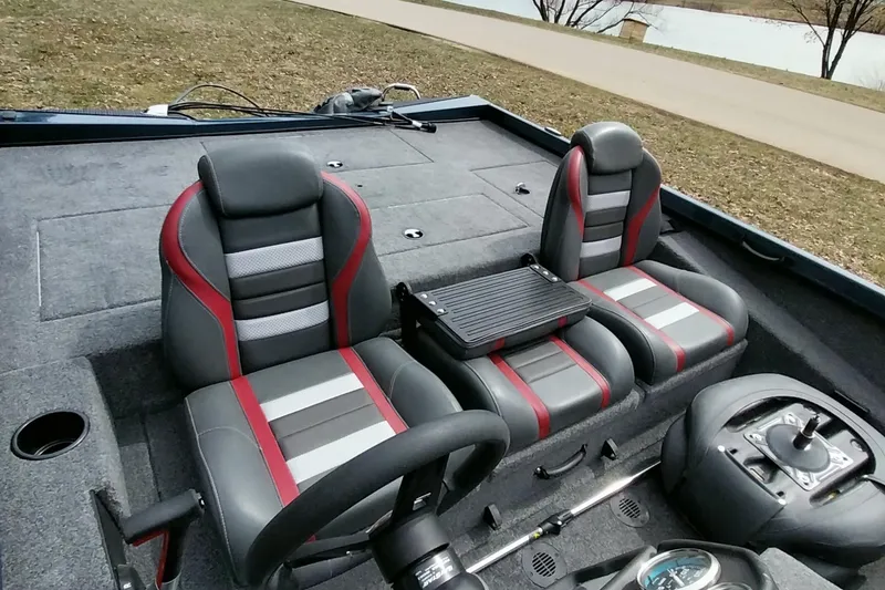 Slide: The Image of 2024 Ranger RT198P boat interior with dual seats, steering wheel, and control panel. - 38