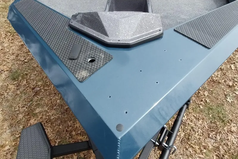 Slide: The Image of 2024 Ranger RT198P boat deck with textured surfaces and sleek blue finish. - 43