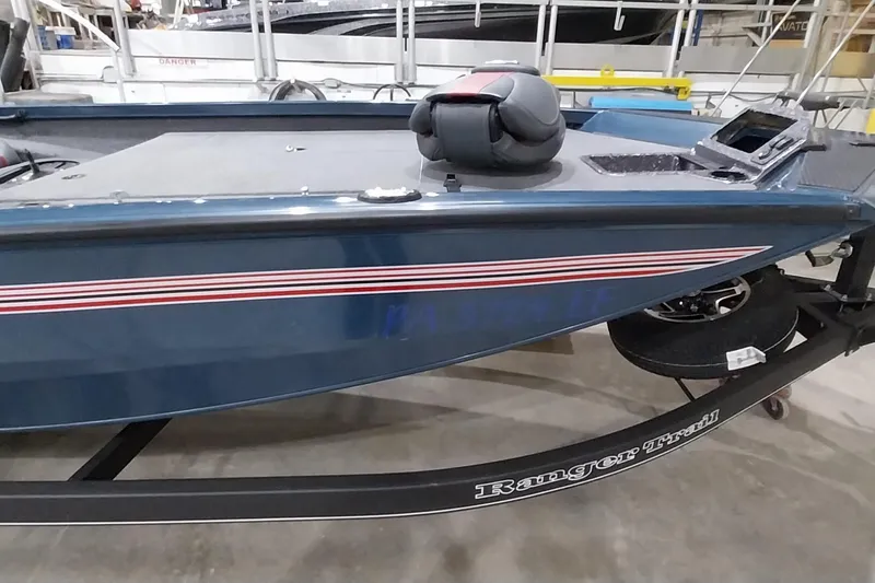 Slide: The Image of 2024 Ranger RT198P boat on trailer in showroom setting. - 5