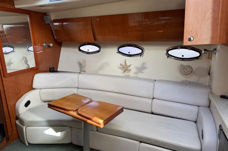 Slide: The Image of Luxurious interior of 2005 Regal Commodore 3860 yacht with leather seating and wooden accents. - 17