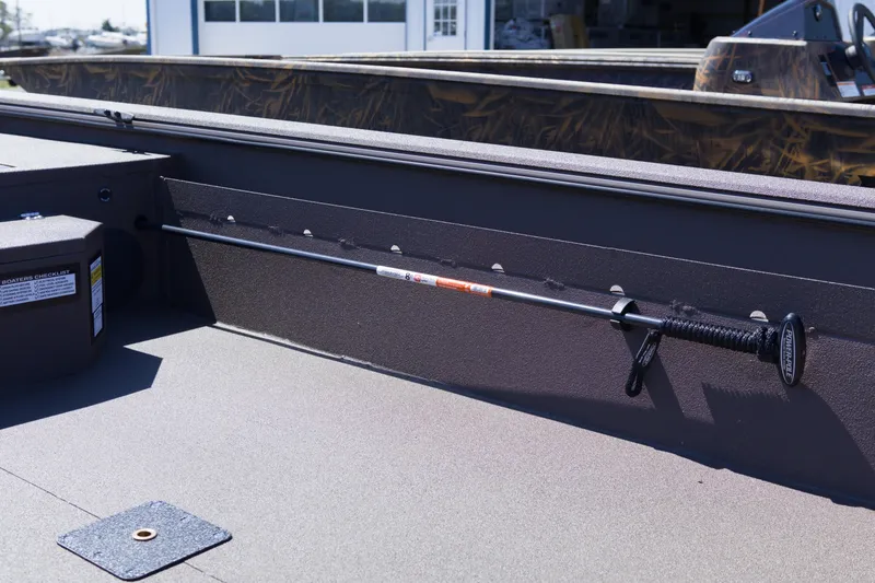 Slide: The Image of Interior view of a 2026 Avid 18 Commander boat showcasing storage and equipment features. - 5