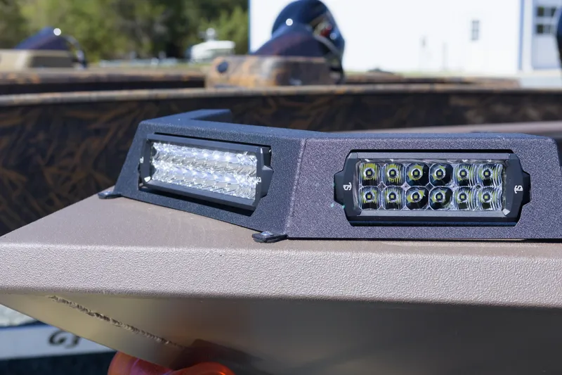 Slide: The Image of Close-up of LED lights on a 2026 Avid 18 Commander boat. - 7