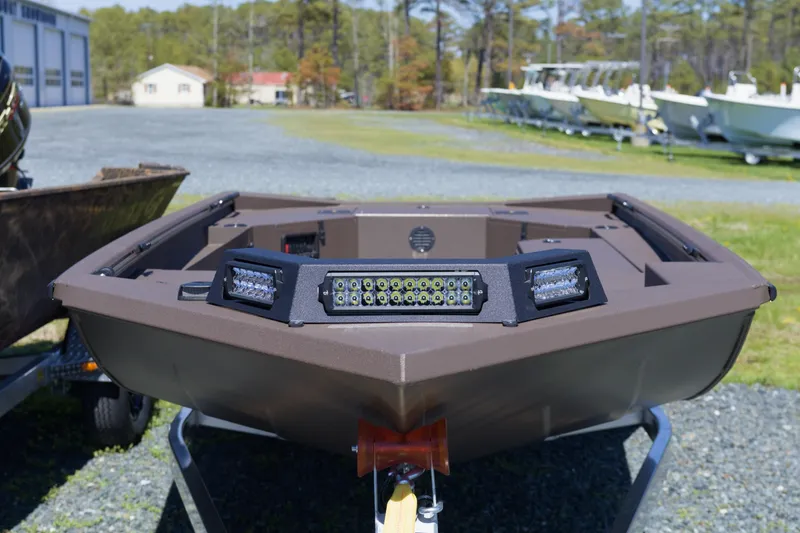 Slide: The Image of 2026 Avid 18 Commander boat with LED lights on display outdoors. - 8