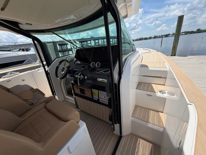 Slide: The Image of The image shows the cockpit of a 2027 Saxdor 400 GTS with modern instruments and comfortable seating. - 24
