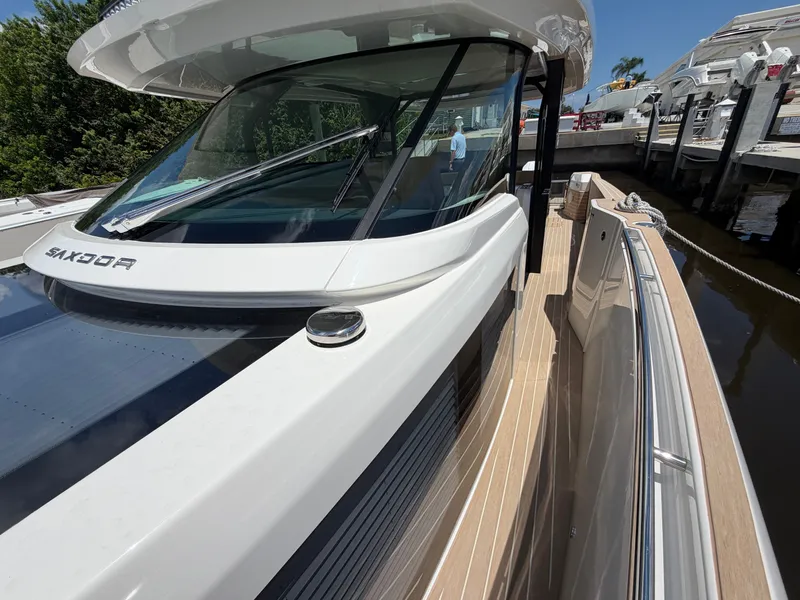 Slide: The Image of The 2027 Saxdor 400 GTS features a modern design with sleek lines and a spacious deck. - 43