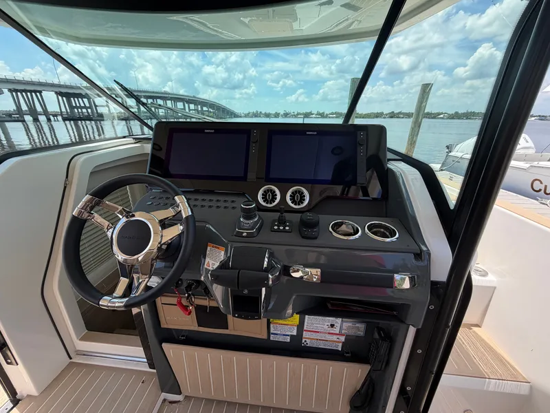 Slide: The Image of The 2027 Saxdor 400 GTS cockpit features a modern steering wheel and two large screens. - 28