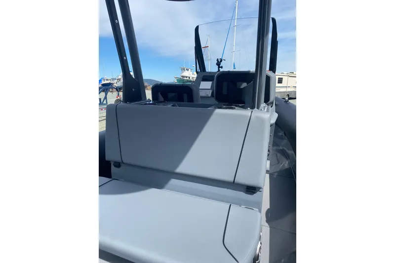 Slide: The Image of 2024 Sealegs 7.5 boat interior with gray seating and visible dashboard. - 12