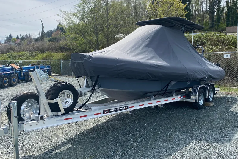 Slide: The Image of 2024 Sealegs 7.5 boat covered on trailer in outdoor setting. - 17