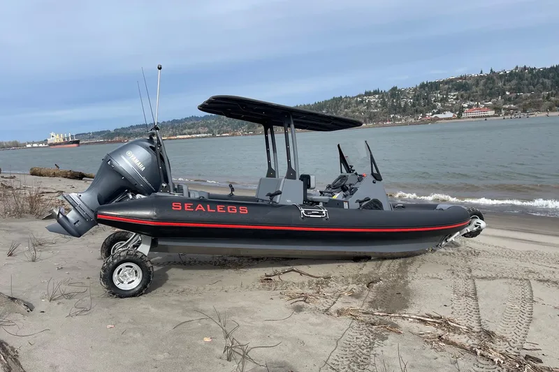 Slide: The Image of 2024 Sealegs 7.5 amphibious boat on sandy beach with Yamaha engine. - 5