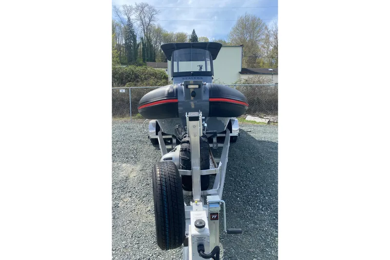 Slide: The Image of 2024 Sealegs 7.5 boat on trailer, parked outdoors, front view. - 6