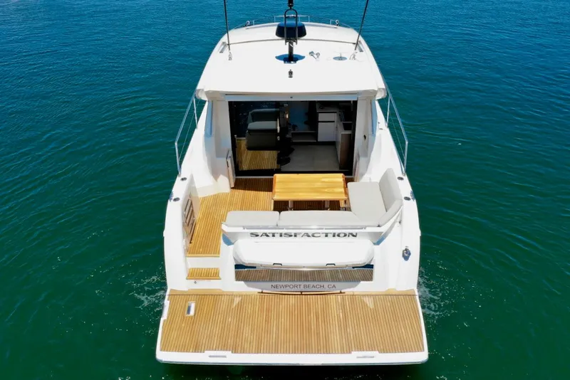 Slide: The Image of Rear view of Prestige 460 S yacht, 2020 model, on open water. - 11