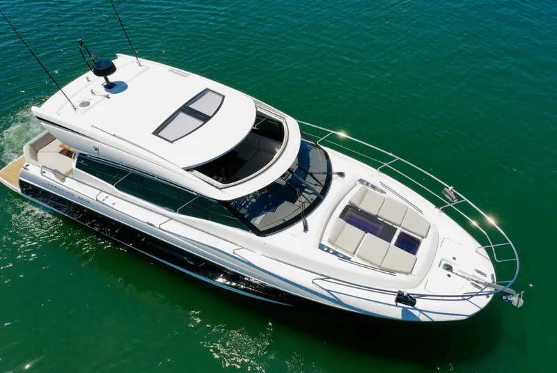 Slide: The Image of Aerial view of a 2020 Prestige 460 S yacht on the water. - 15