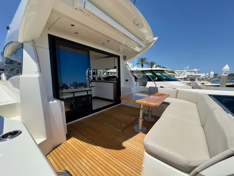 Slide: The Image of Prestige 460 S 2020 yacht with elegant outdoor deck and seating area. - 37