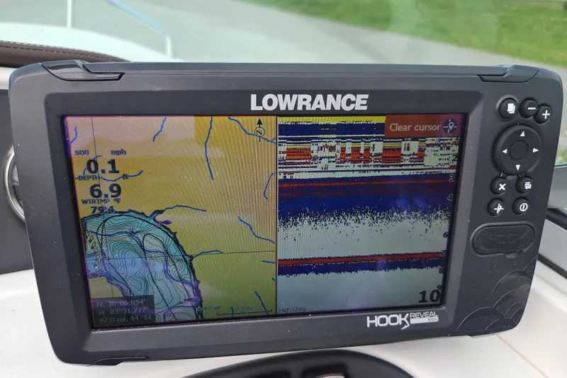 Slide: The Image of Lowrance Hook Reveal GPS on 2016 Rinker 236 Captiva Cuddy displaying navigation and sonar data. - 12