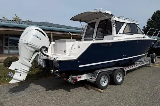 Slide: The Image of 2026 Cutwater C-248 Coupe boat on trailer with Yamaha outboard motor. - 2