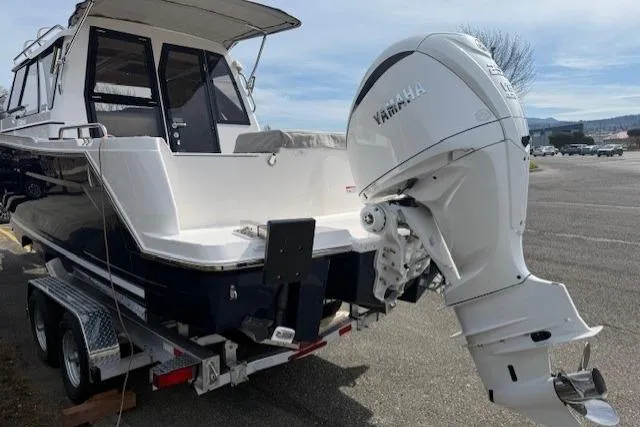 Slide: The Image of 2026 Cutwater C-248 Coupe boat with Yamaha outboard motor on trailer. - 3