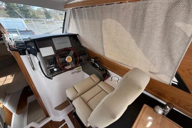Slide: The Image of 2026 Cutwater C-248 Coupe helm with modern controls and comfortable seating. - 9