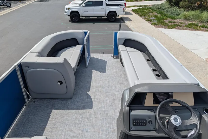 Slide: The Image of 2026 Sun Tracker Party Barge 18 DLX pontoon boat with spacious seating and modern helm. - 6