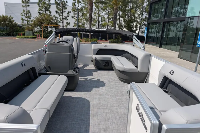 Slide: The Image of 2026 Sun Tracker Party Barge 16 DLX interior with gray seating and modern design. - 10