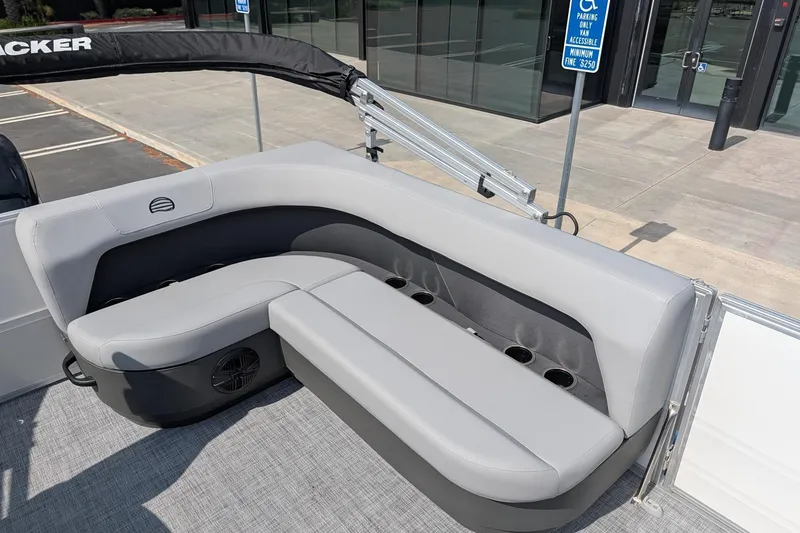 Slide: The Image of 2026 Sun Tracker Party Barge 16 DLX with gray seating and cup holders. - 9