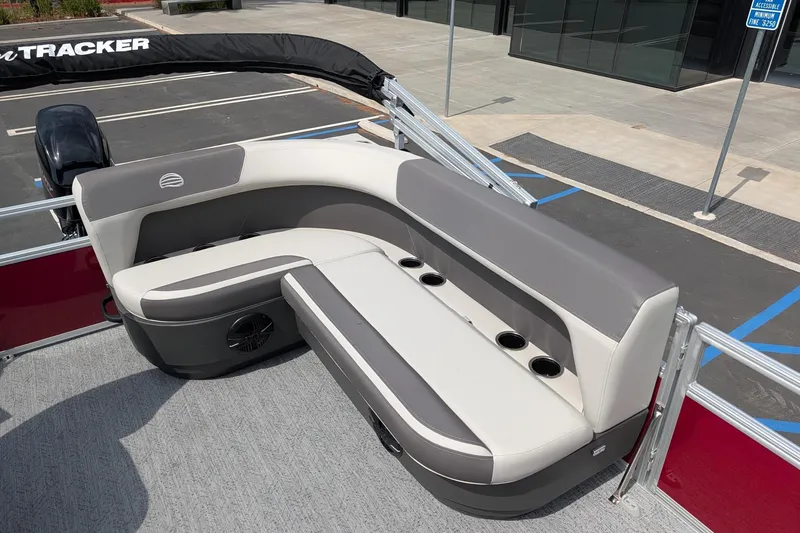 Slide: The Image of 2026 Sun Tracker Bass Buggy 16 XL Select pontoon boat with cushioned seating and cup holders. - 10