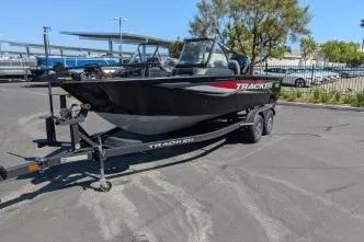 Slide: The Image of 2026 Tracker Targa V-18 WT boat on trailer in parking lot. - 2