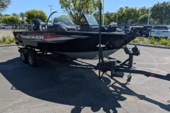 Slide: The Image of 2026 Tracker Targa V-18 WT boat on trailer in sunny parking lot. - 3
