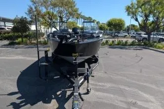 Slide: The Image of 2026 Tracker Targa V-18 WT boat on trailer in parking lot. - 4