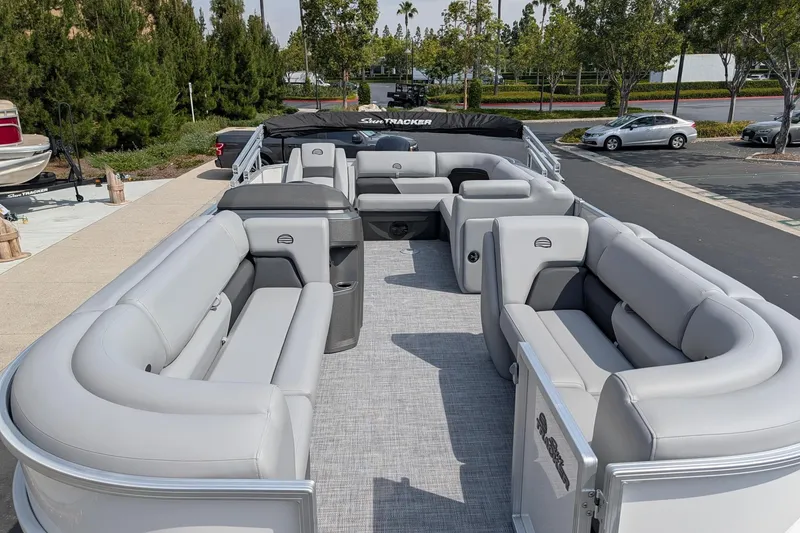 Slide: The Image of 2026 Sun Tracker Party Barge 20 DLX pontoon boat with spacious seating and modern design. - 3