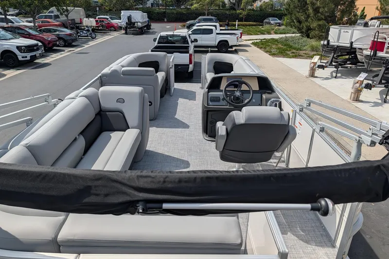 Slide: The Image of 2026 Sun Tracker Party Barge 20 DLX pontoon boat with spacious seating and modern helm. - 4