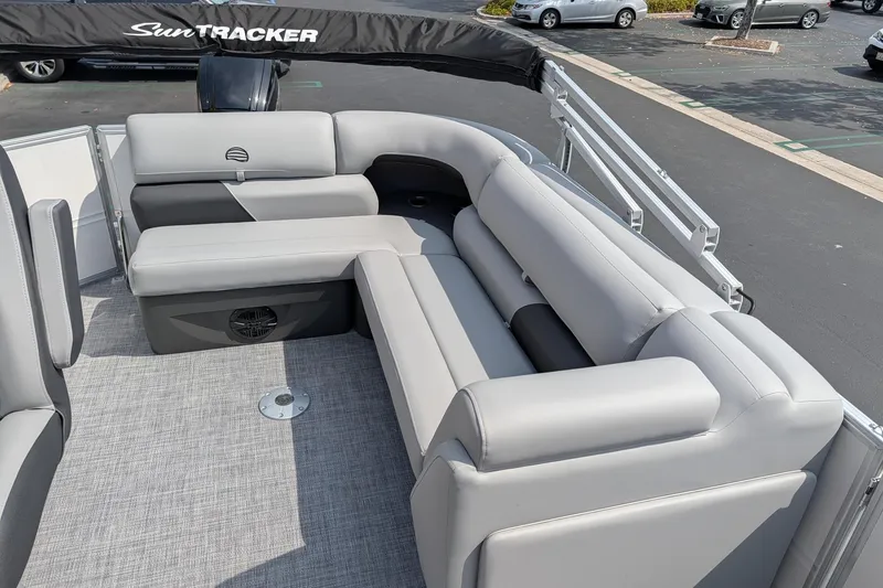 Slide: The Image of 2026 Sun Tracker Party Barge 20 DLX with spacious gray seating and sleek design. - 6