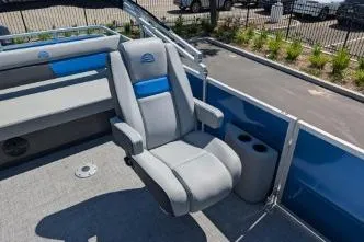 Slide: The Image of 2026 Sun Tracker Party Barge 22 RF XP3 boat seat with cup holders and blue accents. - 4