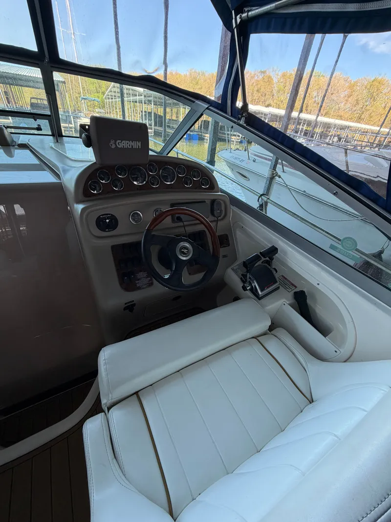 Slide: The Image of Helm of 2001 Sea Ray 290 Sundancer with Garmin navigation. - 10