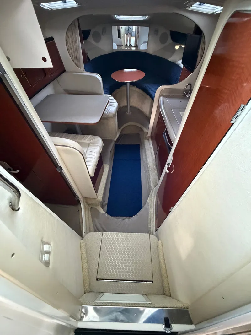 Slide: The Image of Interior of a 2001 Sea Ray 290 Sundancer yacht with seating area. - 14