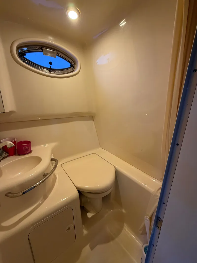 Slide: The Image of Sea Ray 290 Sundancer 2001 bathroom with sink and toilet. - 18