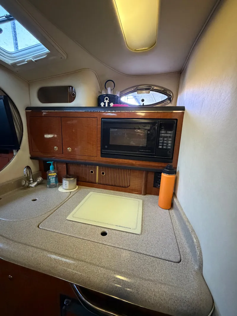Slide: The Image of Galley in a 2001 Sea Ray 290 Sundancer yacht. - 19