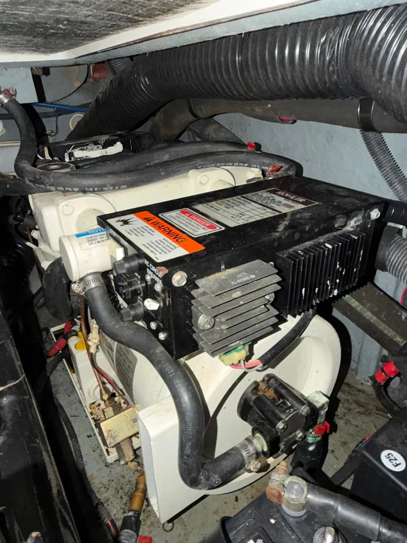 Slide: The Image of Engine compartment of a 2001 Sea Ray 290 Sundancer boat. - 22