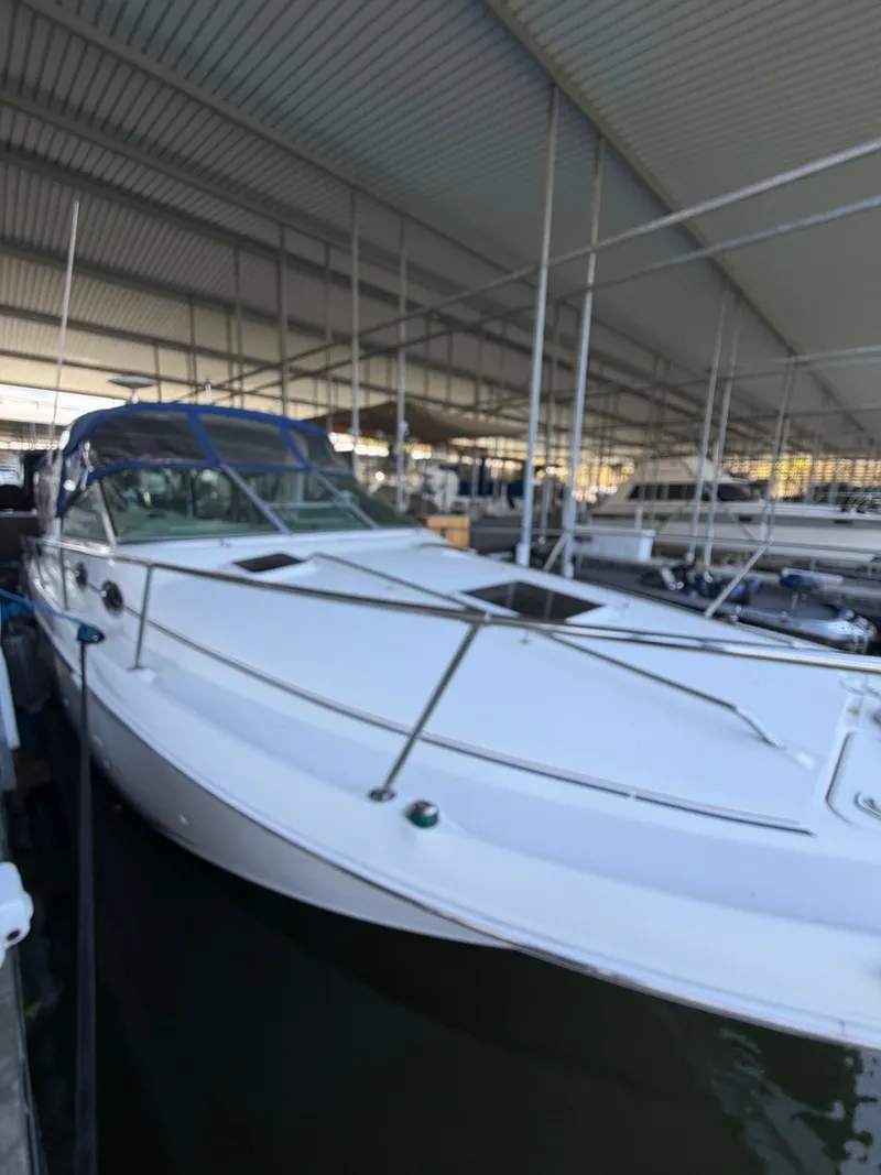 Slide: The Image of 2001 Sea Ray 290 Sundancer in covered marina. - 4