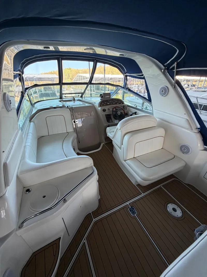 Slide: The Image of Interior of a 2001 Sea Ray 290 Sundancer yacht with white seating. - 7