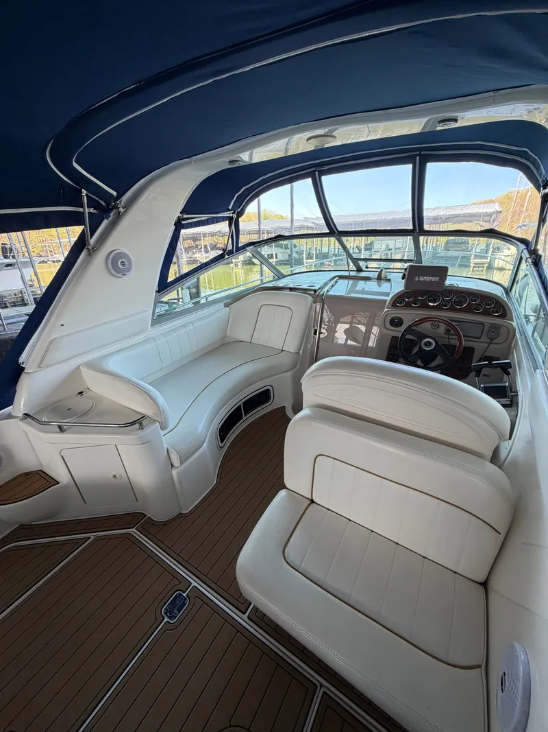 Slide: The Image of Interior of a 2001 Sea Ray 290 Sundancer with white upholstery. - 8
